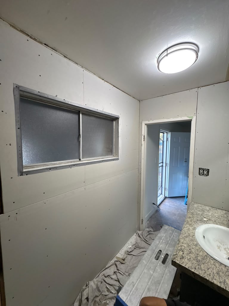 Fresh drywall hung and ready for texture in a Las Vegas bathroom remodel