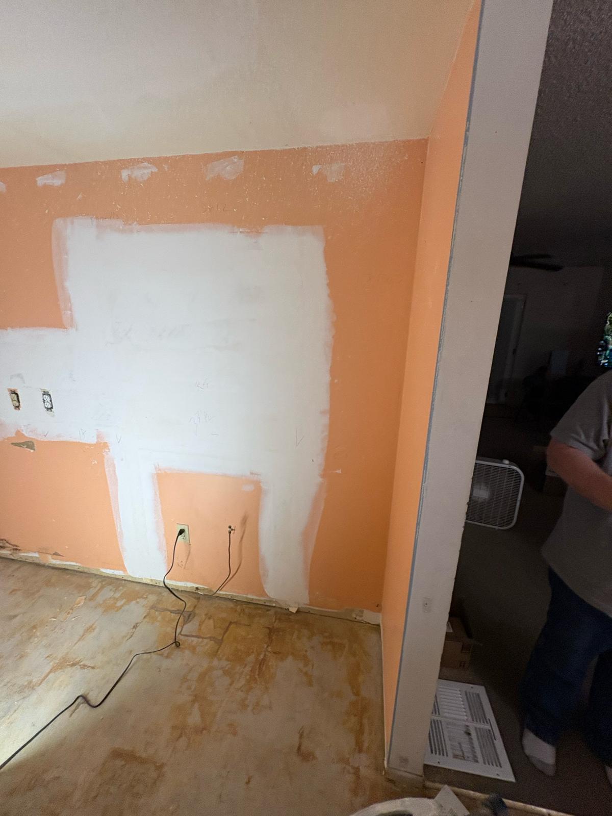 Kitchen walls being patched and skim-coated during a Las Vegas remodel