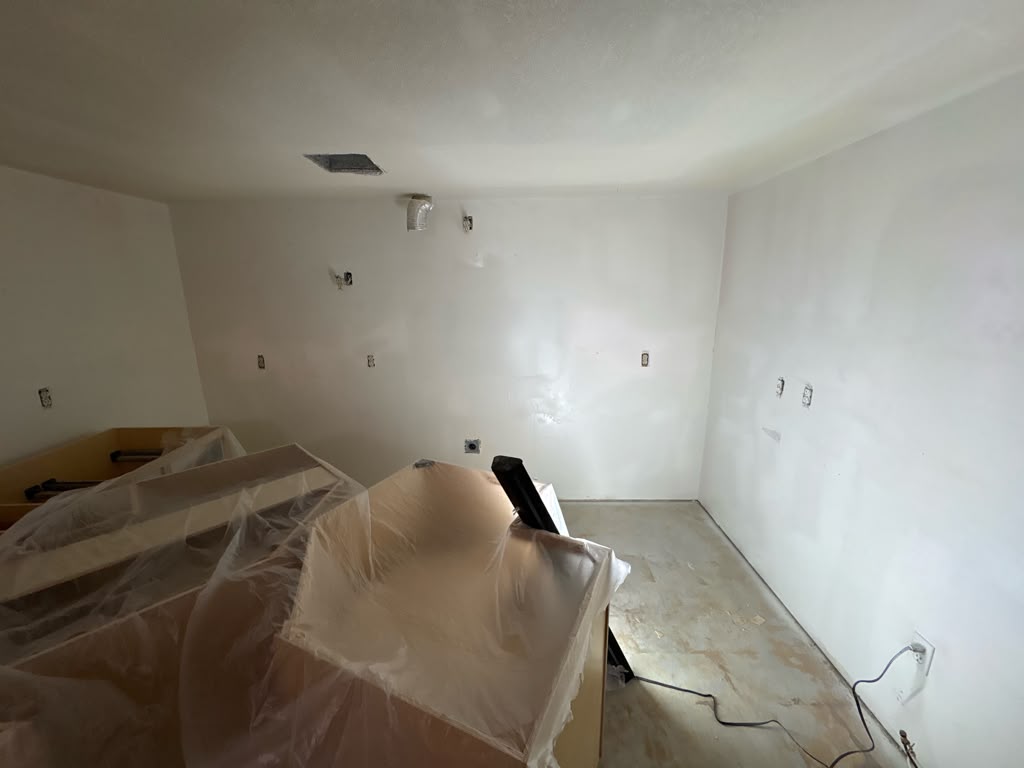 Kitchen walls nearly fully skim-coated smooth in a Las Vegas remodel