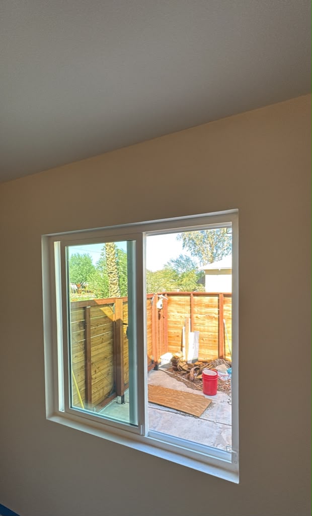 New vinyl sliding window installed with trimmed and painted wall in Las Vegas