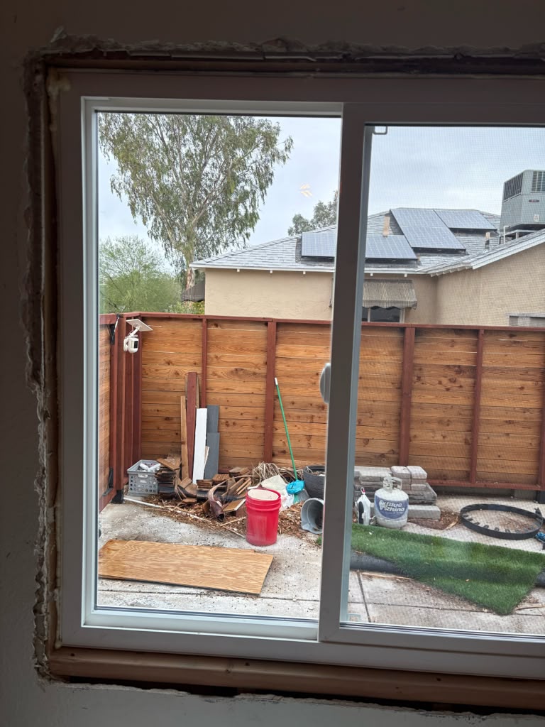 Rough opening with new sliding window set and foam-sealed during replacement in Las Vegas